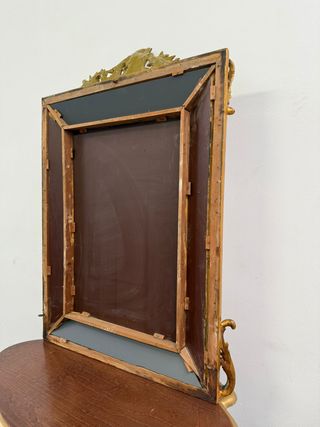 Fantastico specchio dorato con pennacchio,