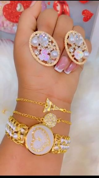 Juego de reloj y joyas azul y dorado