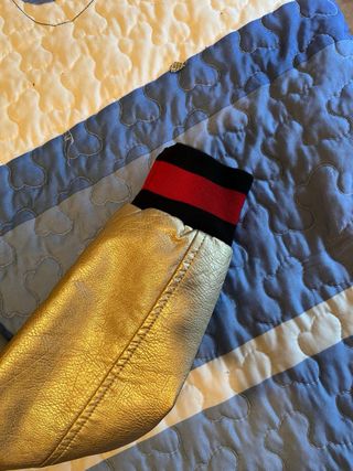 Chaqueta bomber dorada