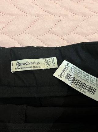 Mini falda negra con cinturón Stradivarius xs 34
