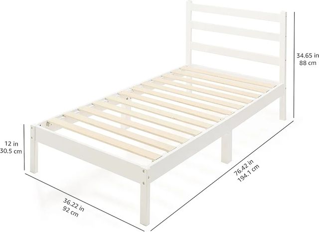 Cama individual blanca de madera con cabecero