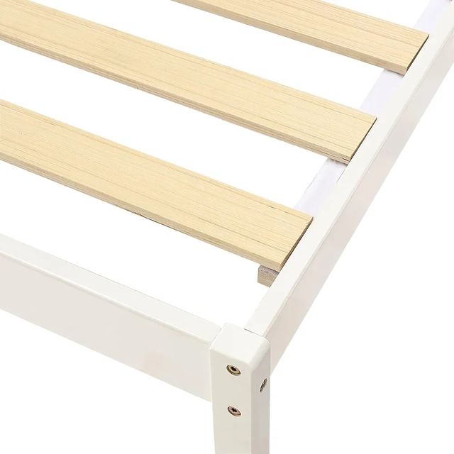 Cama individual blanca de madera con cabecero