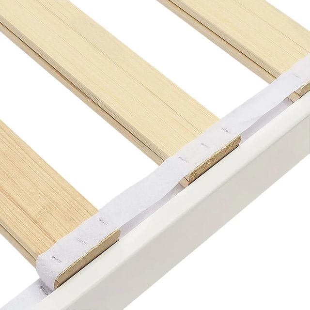 Cama individual blanca de madera con cabecero