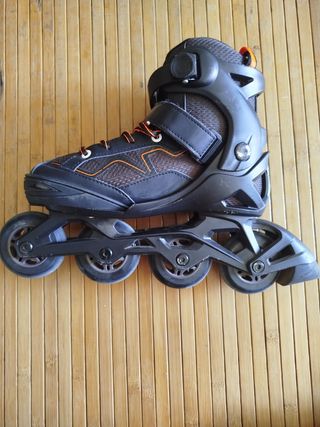 Patines Oxelo línea negro y naranja.
