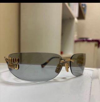 Gafas sol MIU MIU doradas grises