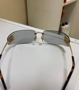 Gafas sol MIU MIU doradas grises