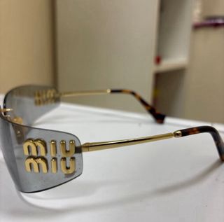Gafas sol MIU MIU doradas grises