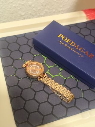 Reloj dorado mujer
