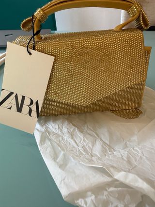 Bolso Zara dorado brillante