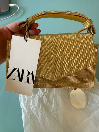 Bolso Zara dorado brillante