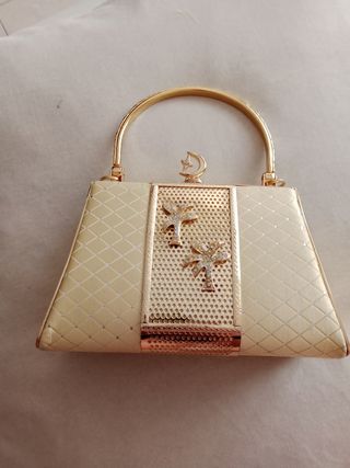 Bolso fiesta dorado.