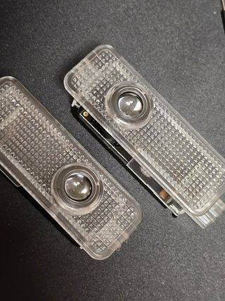 Luces de proyector logo 4 puertas