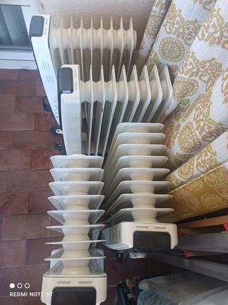 4 Radiadores Eléctricos, con sus embalajes.