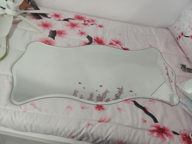 Espejo curvo plateado