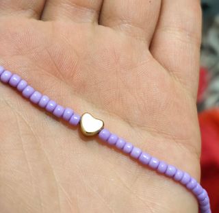 Tobillera morada corazón dorado