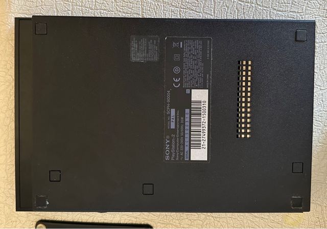 PS2 Slim negra con mandos y juegos