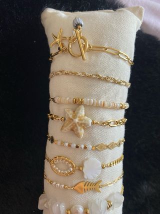 Pulseras doradas y blancas - 10 piezas