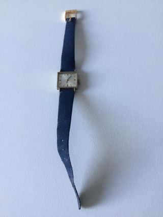 Reloj Tissot dorado y azul