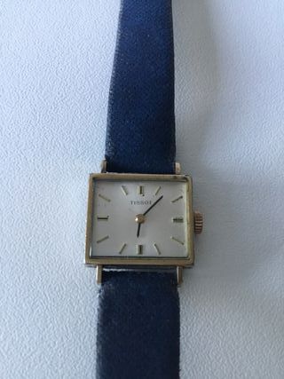 Reloj Tissot dorado y azul