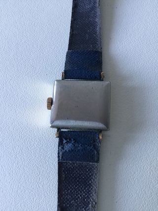 Reloj Tissot dorado y azul