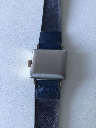 Reloj Tissot dorado y azul