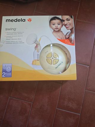 Sacaleches Medela Swing y portabebes 