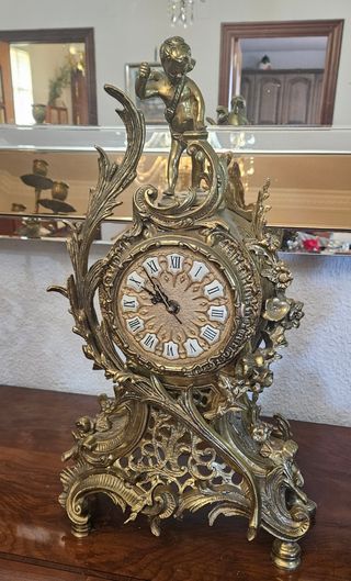 Orologio e lampadari in bronzo dorato