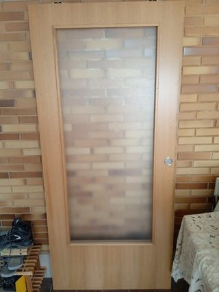 Puerta corredera con cristal