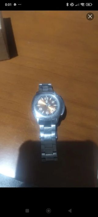 Reloj Timberland naranja 
y plata
