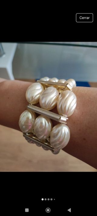 Pulsera perlas doradas 1.50