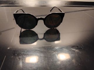 Gafas sol redondas doradas