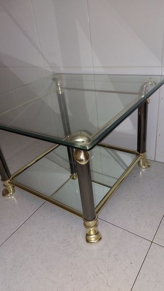 Mesa centro cristal-metal dorada