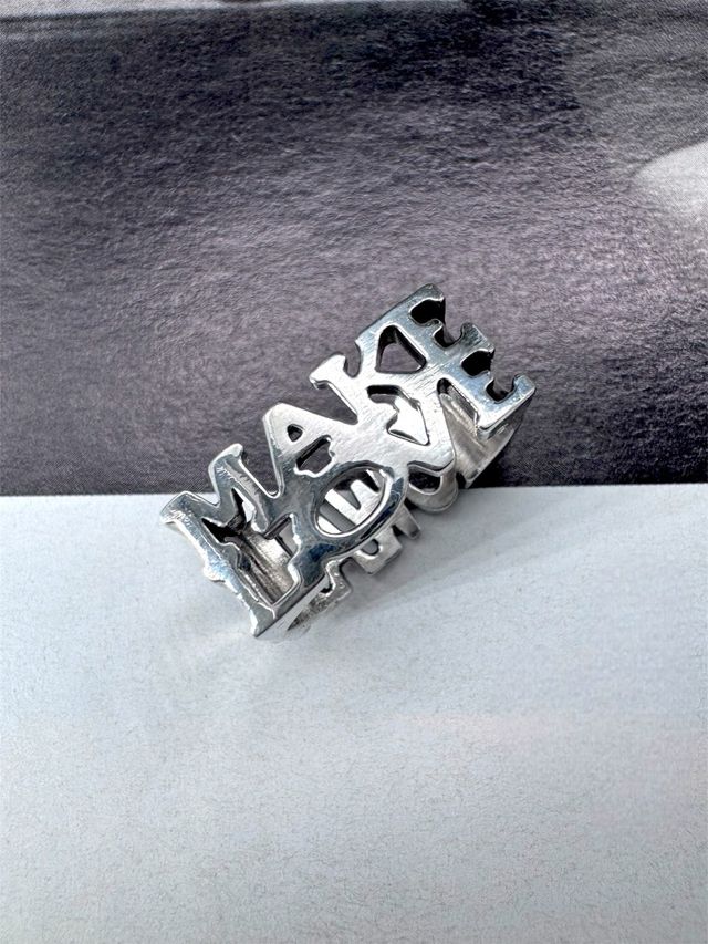 Anel em prata 'Makelove-Nowar'