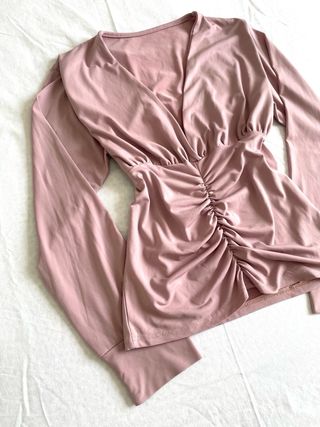 Top rosa a manica lunga taglia M