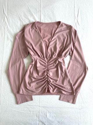 Top rosa a manica lunga taglia M