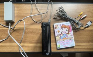 Nintendo Wii Nera + Gioco Babysitting Mama + Cavi