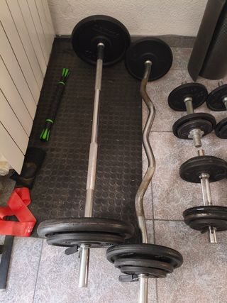 Pesas + 100 kg y barras de pesas