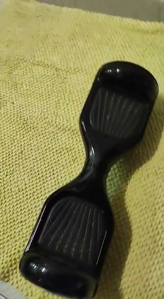 Patin eléctrico . 
Hoverboard negro. 
Patinete 