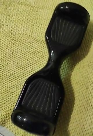 Patin eléctrico . 
Hoverboard negro. 
Patinete 