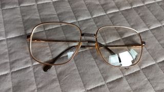 Occhiali vintage uomo in metallo dorato.