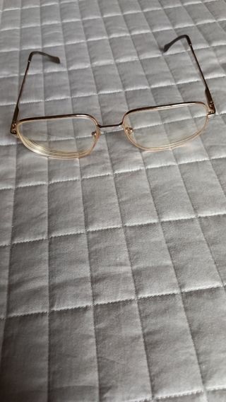Occhiali vintage uomo in metallo dorato.