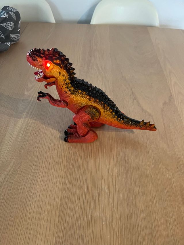 Dinosaurio electrónico infantil