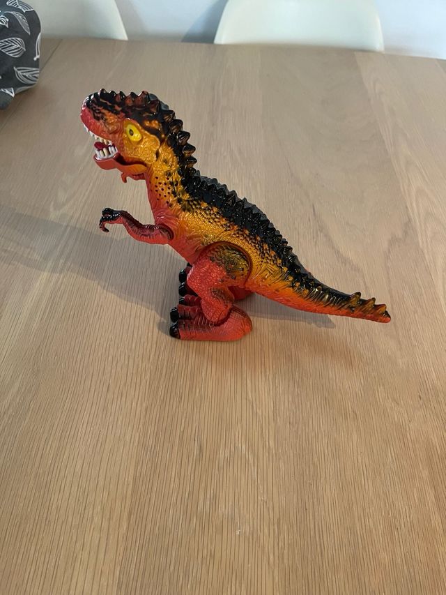 Dinosaurio electrónico infantil