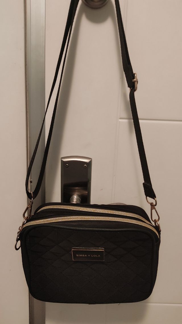 Bolso negro dos compartimentos