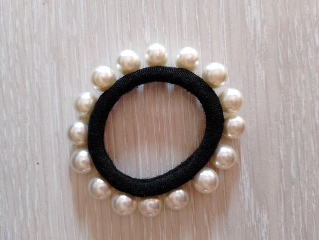 Coletero perlas blancas