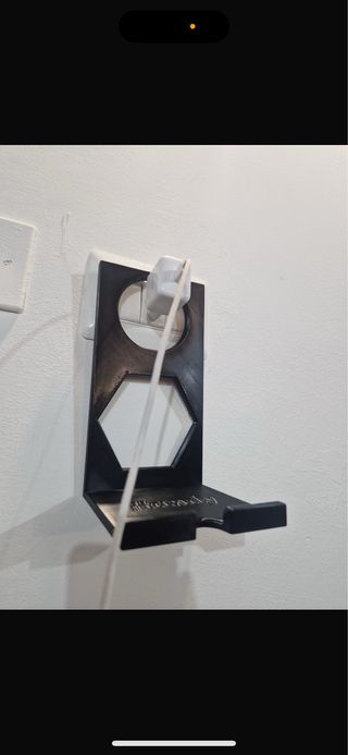Supporto da parete per telefono