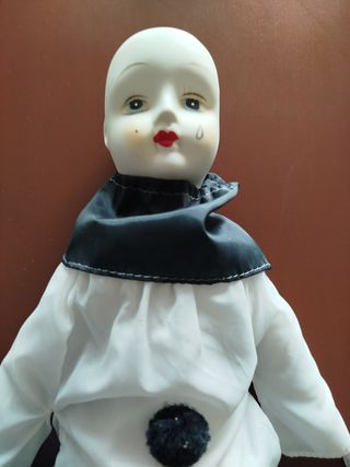 Muñeco payaso porcelana.
