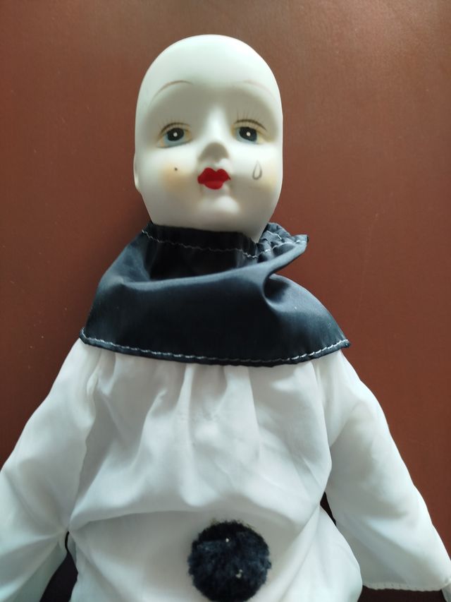 Muñeco payaso porcelana.