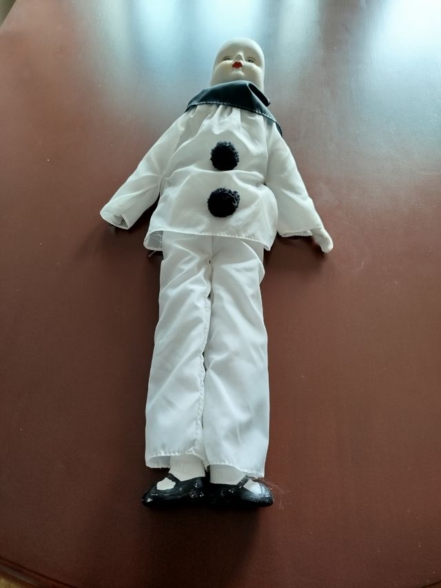 Muñeco payaso porcelana.