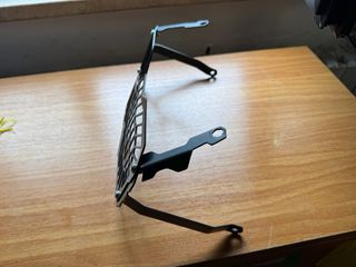 Griglia protezione faro moto